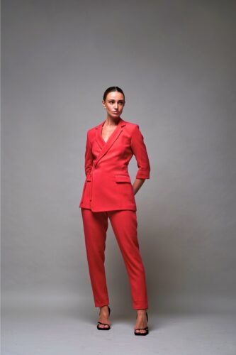 Coral red DWL Sola blazer set with 3/4 sleeves and cinched wrap waist.